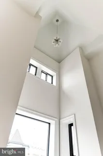 a bed room with a bed and a night stand
