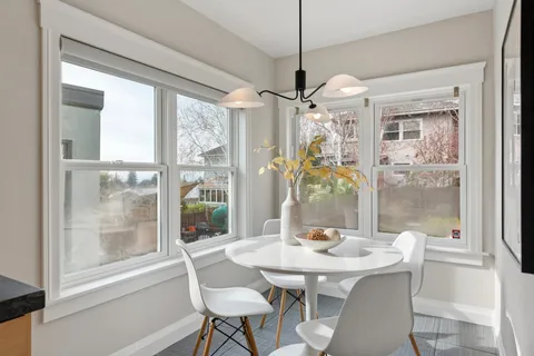 a view of a dining room with furniture window and outside view