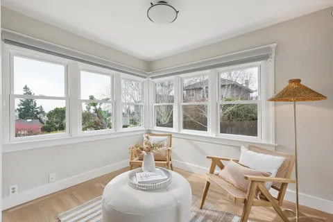 a view of a dining room with furniture window and outside view