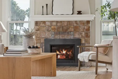 a living room with furniture and a fireplace