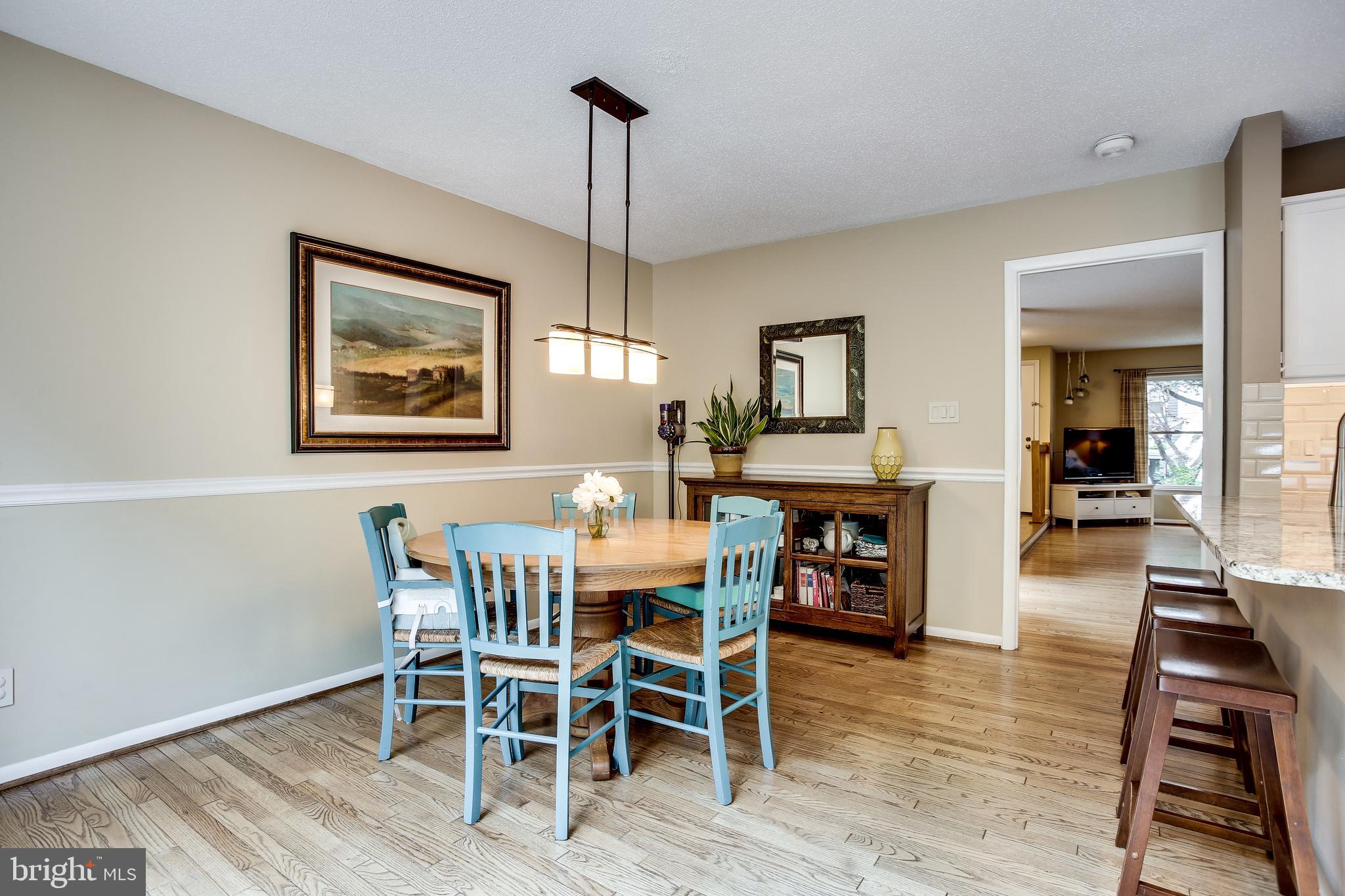 1630 Oak Spring Way Reston, VA 20190 - Photo 24 of 74 Kitchen & family room area w/elegant chair rail