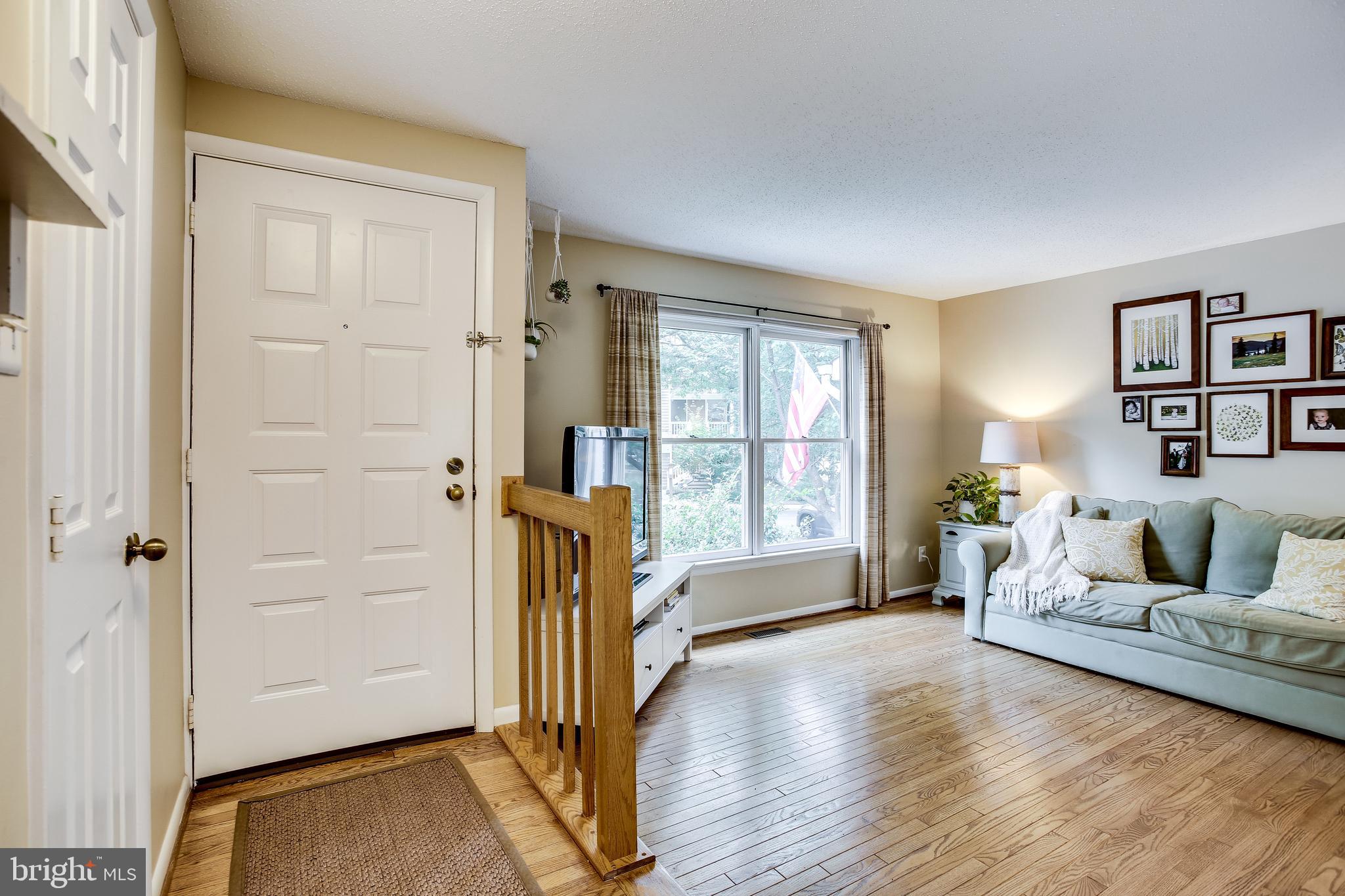 1630 Oak Spring Way Reston, VA 20190 - Photo 8 of 74 Foyer opens to living room with hardwoods