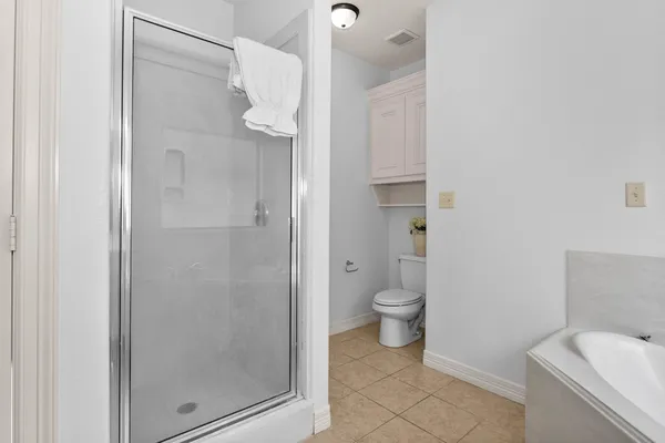 a bathroom with a sink a large mirror and a bathtub