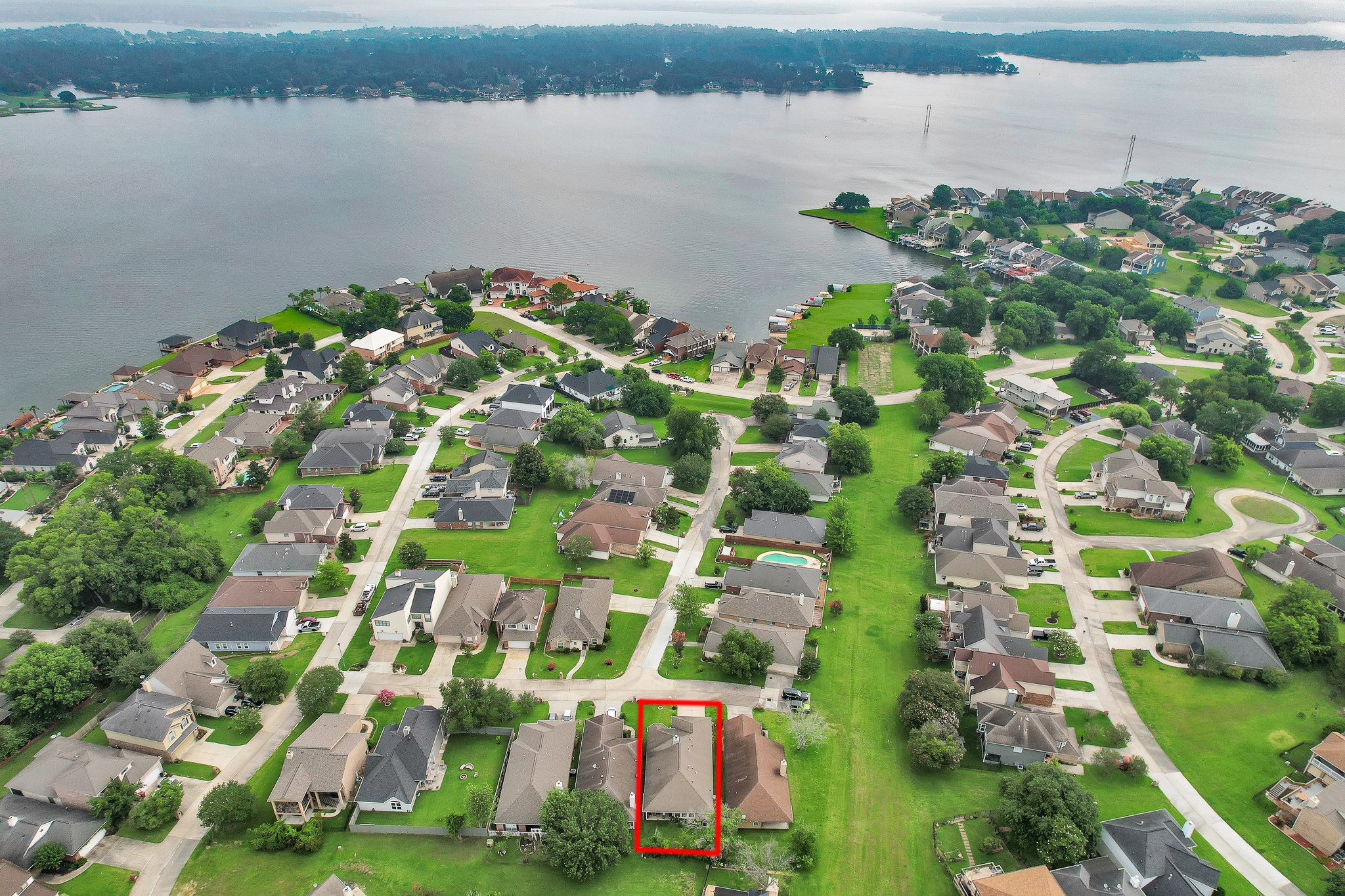 111 Cove Place Montgomery, TX 77356 - Photo 3 of 29 a view of a lake with a building in the background