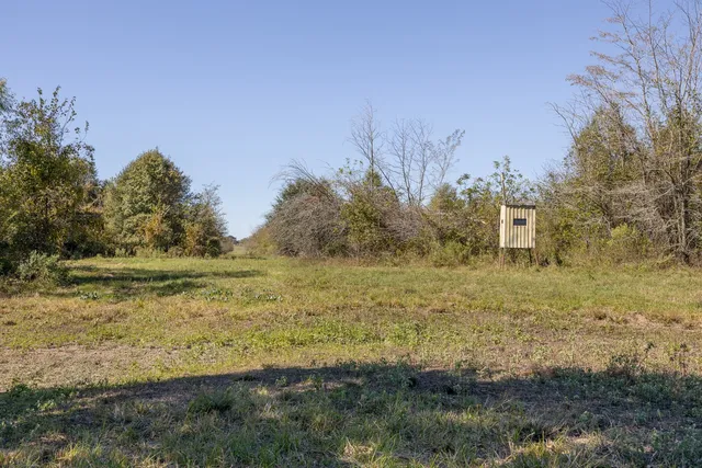 a view of a lake with a yard
