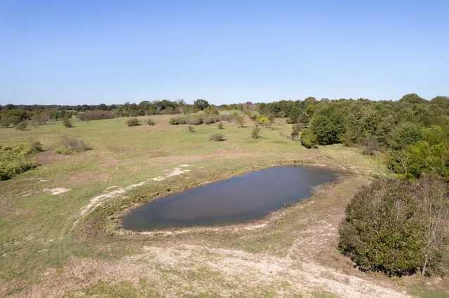 a view of an ocean beach and mountain