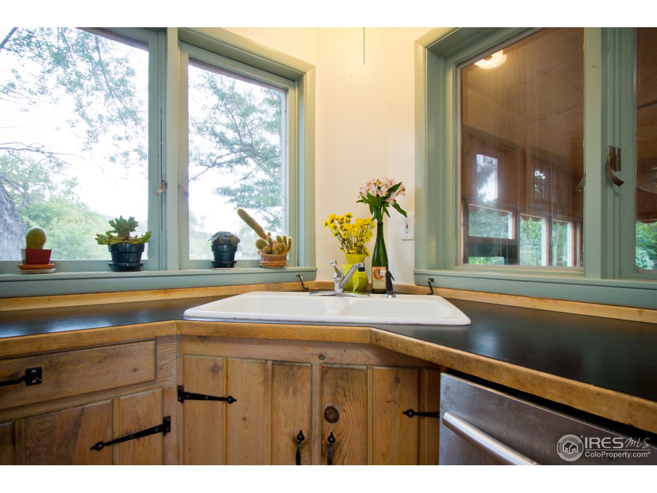 732 Apple Valley Road Lyons, CO 80540 - Photo 8 of 25 a bathroom with a sink and a large window