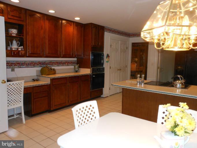 3603 Jackson Cabin Road Phoenix, MD 21131 - Photo 23 of 30 a kitchen with a sink and cabinets