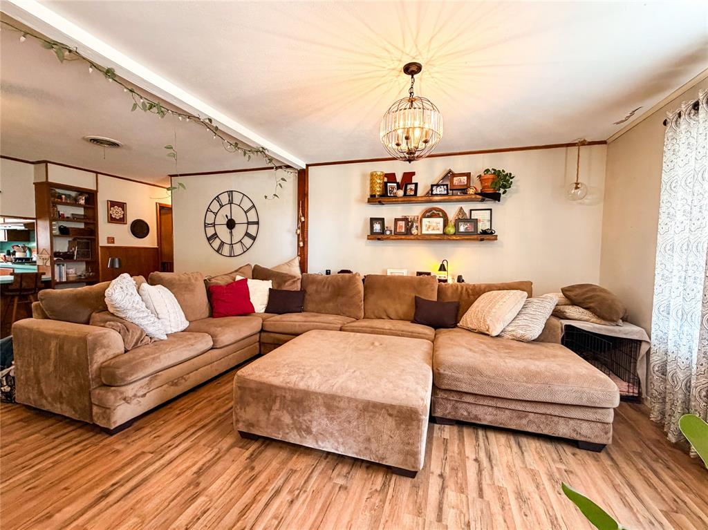 1706 North Ave H Haskell, TX 79521 - Photo 5 of 25 a living room with furniture and a wooden floor