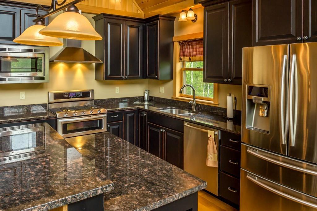 116 Monkey Brook Road Newry, ME 04261 - Photo 8 of 35 Two-tiered island clad in barn board...