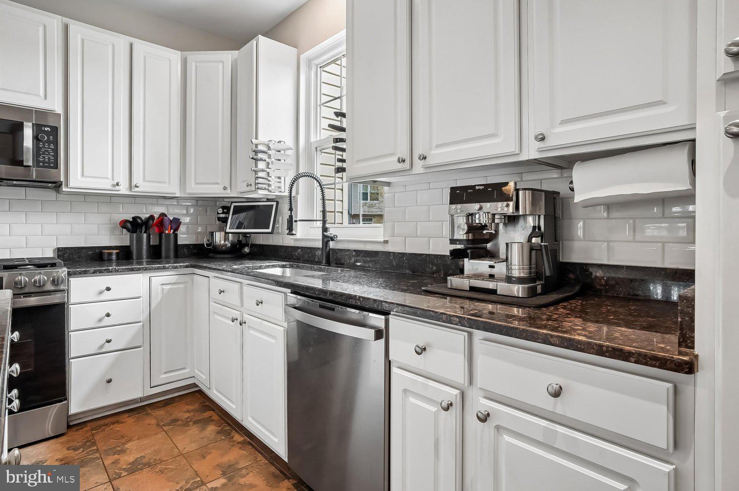 3757 Glebe Meadow Way Edgewater, MD 21037 - Photo 17 of 61 Modern kitchen with sleek white cabinetry.
