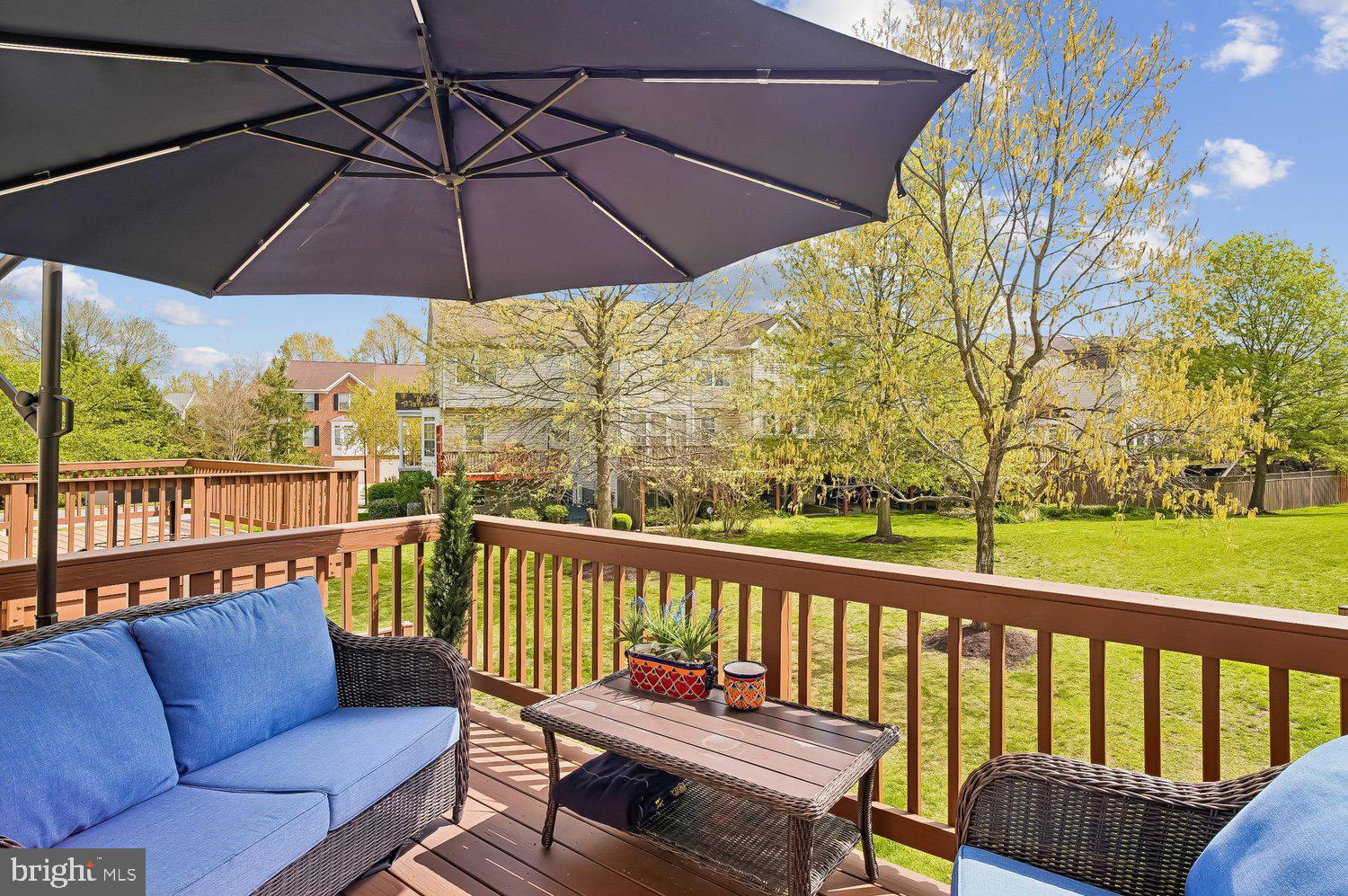 3757 Glebe Meadow Way Edgewater, MD 21037 - Photo 7 of 61 Sunny deck with lush green backyard views.