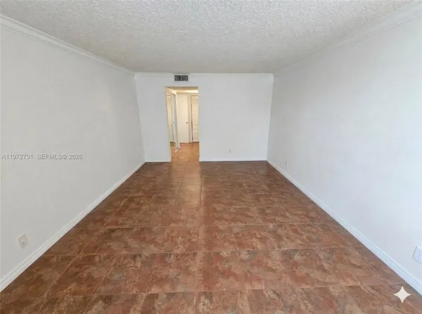 a view of an empty room and window