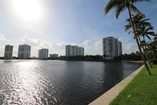 a view of a city with a lake