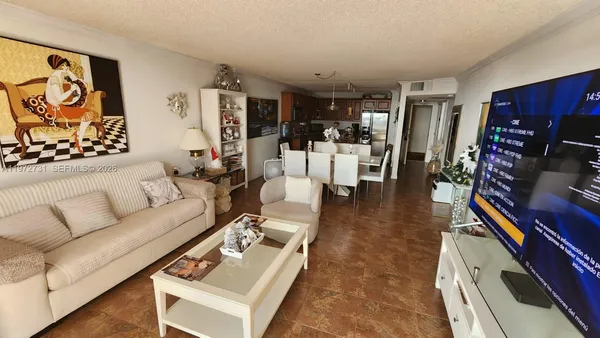 a living room with furniture and gym equipment