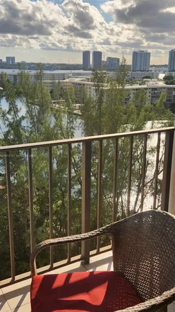 a view of a balcony with lake view and city view