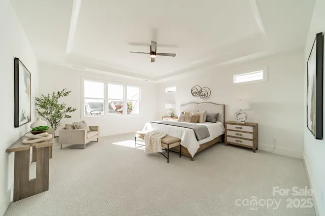 a bedroom with furniture and windows