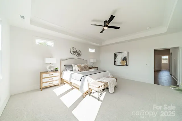 a bedroom with a bed and a large mirror