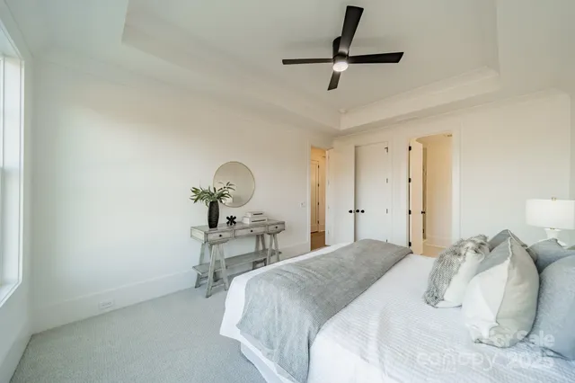 a bedroom with a bed and a table in it