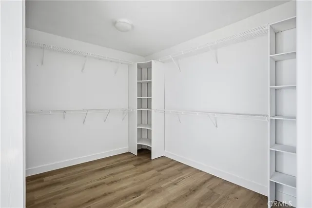 an empty room with wooden floor