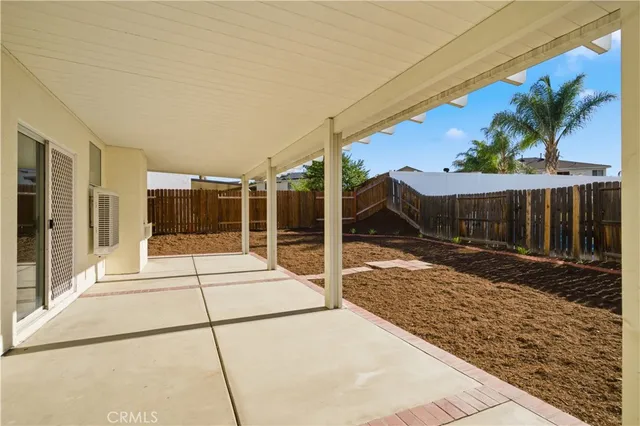 a view of backyard with small cabin