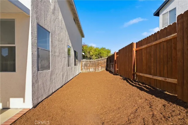 a view of a back yard of the house