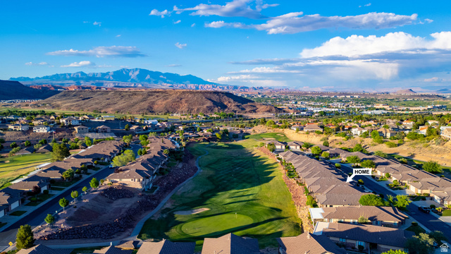2212 Chippenham Court St. George, UT 84770 - Photo 56 of 75 Aerial view of residential area featuring a mountain backdrop and a golf club
