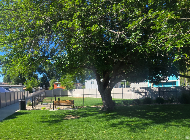1500 Angel Street North, Unit 53 Layton, UT 84041 - Photo 20 of 20 Expansive green space featuring a mature shade tree and manicured lawn