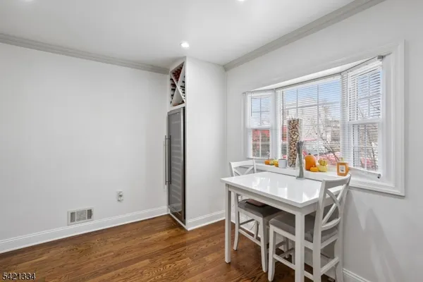 a bedroom with furniture and a rug