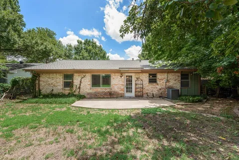 a front view of a house with a yard and porch