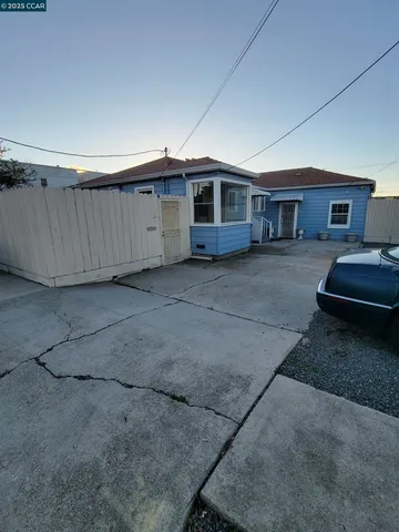 a big room with a table and chairs