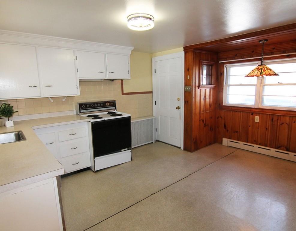 2 Rangeway Road Billerica, MA 01862 - Photo 5 of 11 a kitchen with cabinets appliances and a window