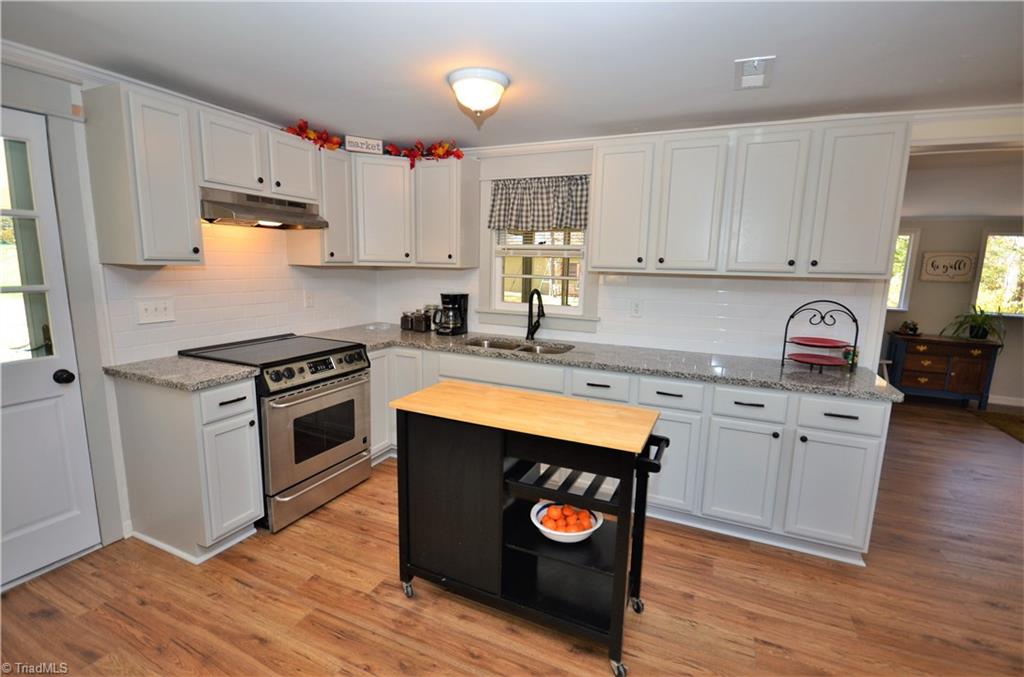 3019 W.O.W. Road Randleman, NC 27317 - Photo 2 of 23 New kitchen - cabinets, granite counter tops, laminate flooring and appliances