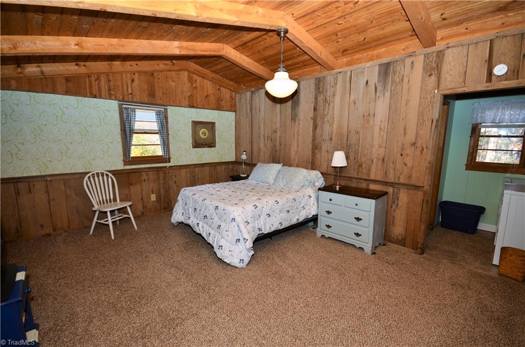 3019 W.O.W. Road Randleman, NC 27317 - Photo 9 of 23 Master bedroom with vaulted wood ceiling