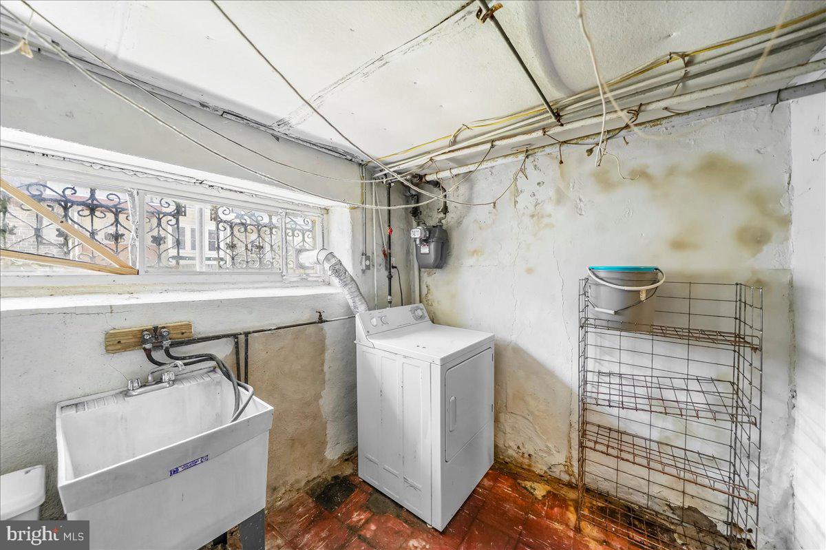 217 Avon Road Upper Darby, PA 19082 - Photo 15 of 16 a bathroom with a sink toilet and shower
