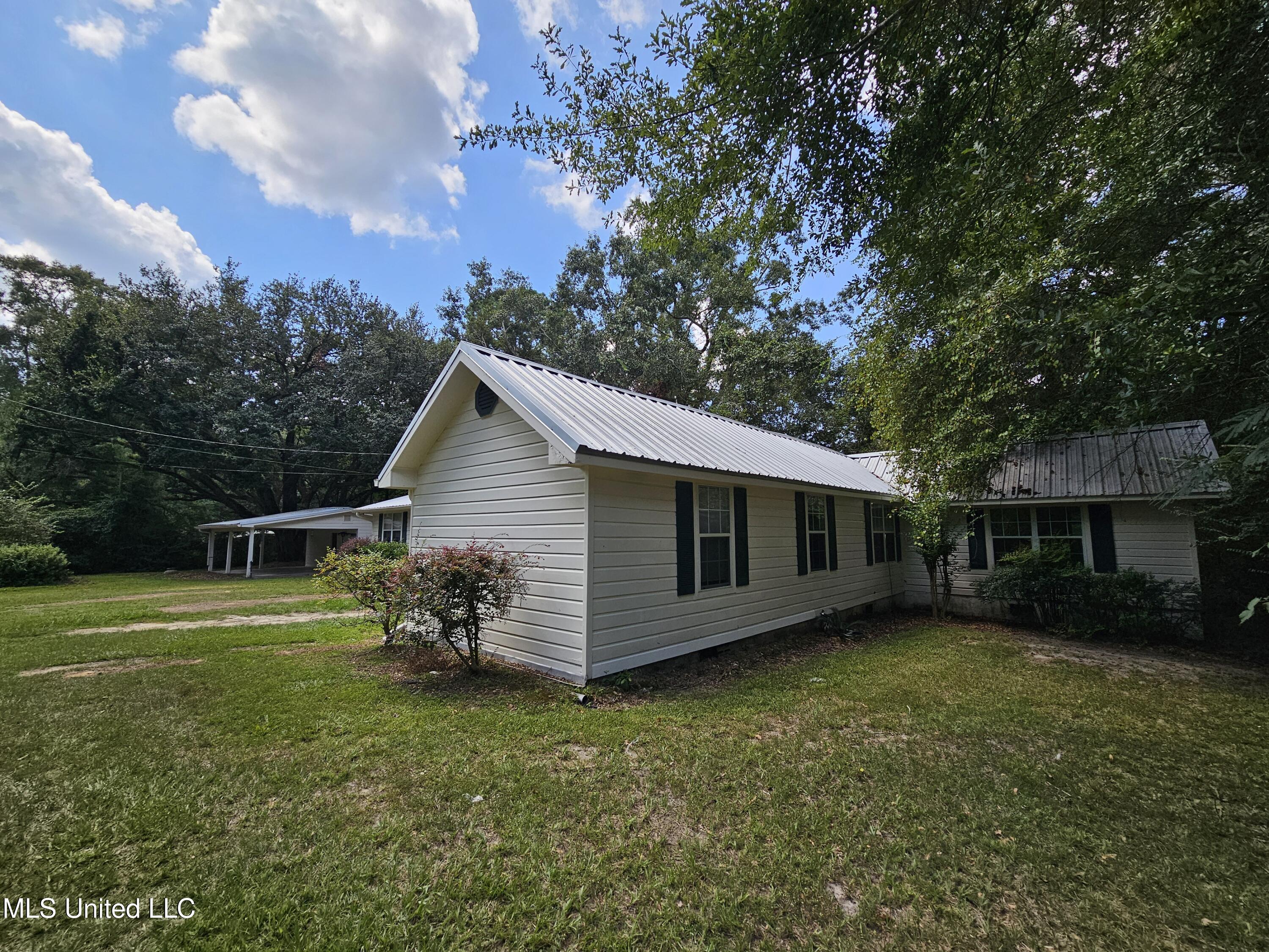 136 Baucum Road Carriere, MS 39426 - Photo 22 of 32 Right side and fron of home
