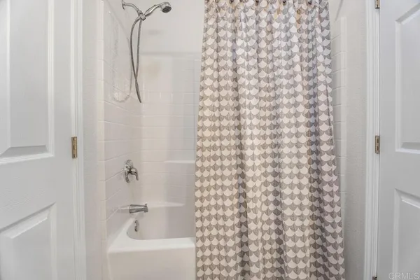 a bathroom with a shower curtain
