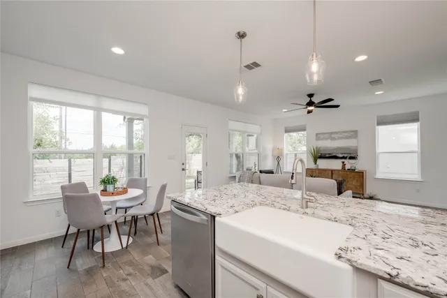 a view of a dining room with furniture window and outside view