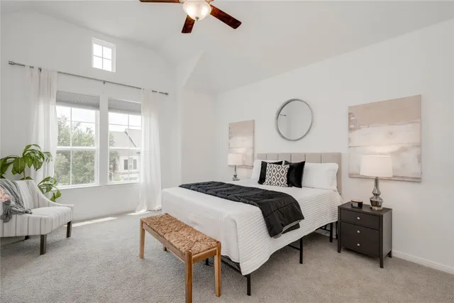 a bed room with a bed and a chair