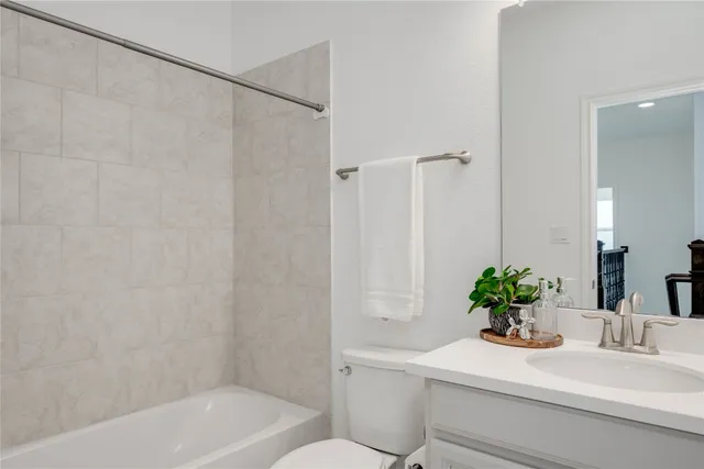 a bathroom with a sink a toilet and a bathtub