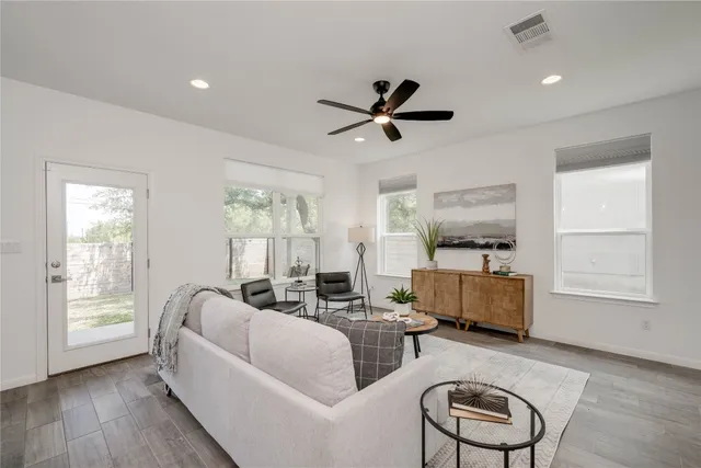 a living room with furniture and a window