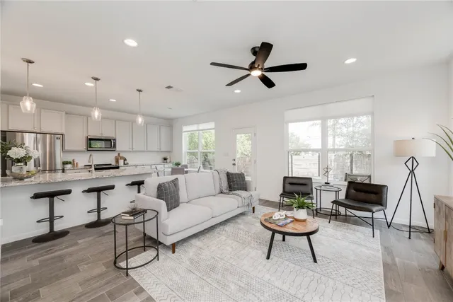 a living room with furniture and a large window