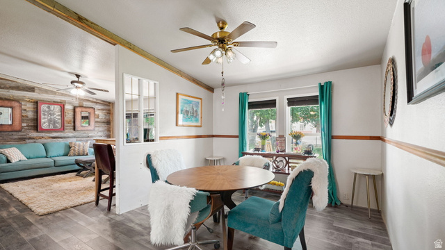 490 South Main Street Kamas, UT 84036 - Photo 10 of 25 Open-concept interior featuring wood-finish flooring, a ceiling fan, and a dining area with natural light
