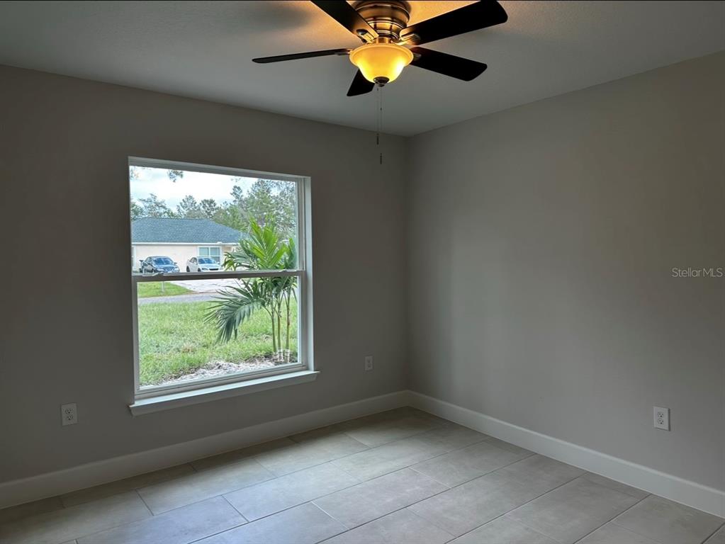 1450 5th Avenue DeLand, FL 32724 - Photo 12 of 16 a view of an empty room with a window