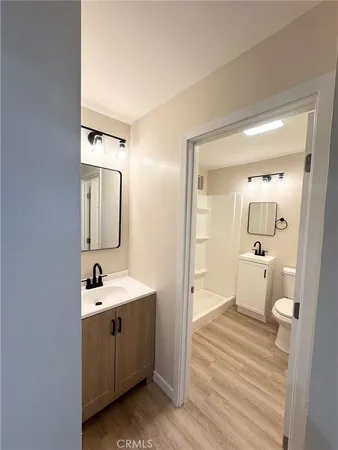 a en suite bathroom with a sink and mirror