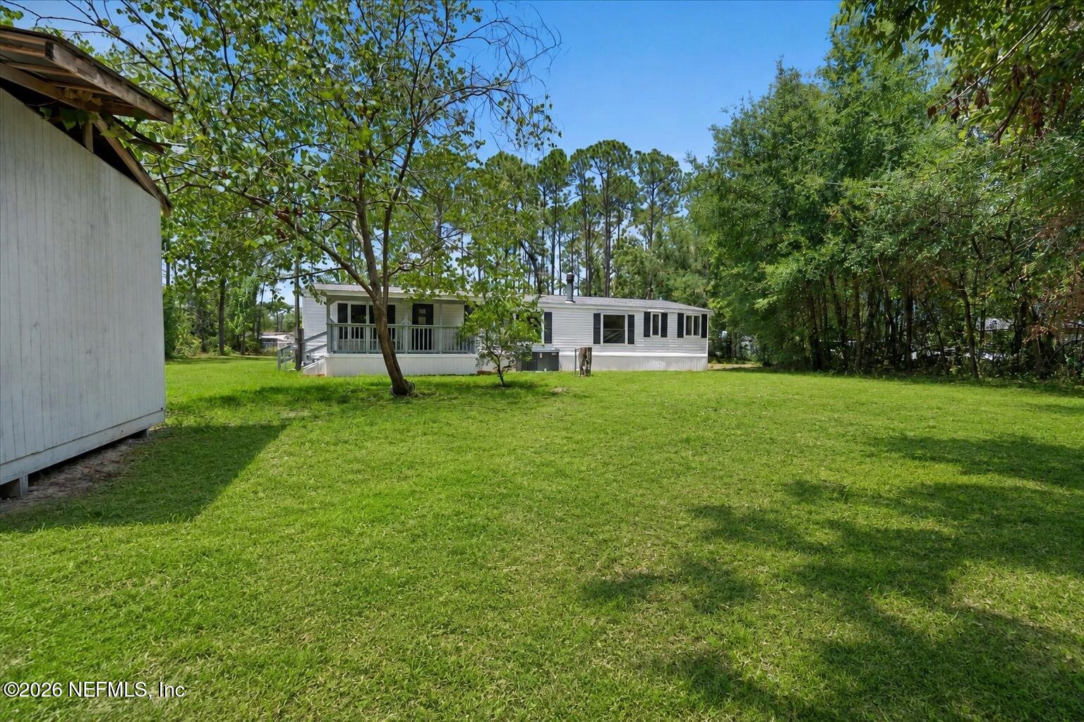 85110 Theresa Road Yulee, FL 32097 - Photo 15 of 43 16_Updated_Backyard_Home_View