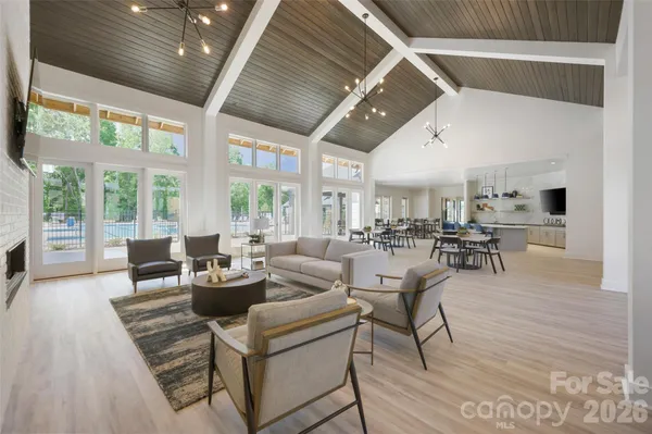 a dining room with furniture and wooden floor