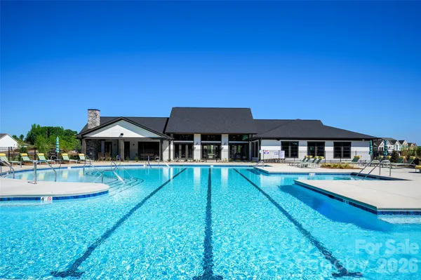 a view of a patio with dining table and chairs