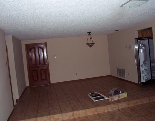 4925 Valley Stream Drive Corpus Christi, TX 78413 - Photo 3 of 10 a view of an empty room with a fireplace