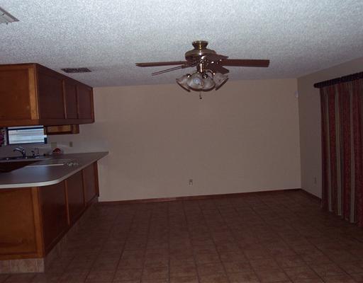 4925 Valley Stream Drive Corpus Christi, TX 78413 - Photo 4 of 10 a view of a kitchen with a sink and cabinets
